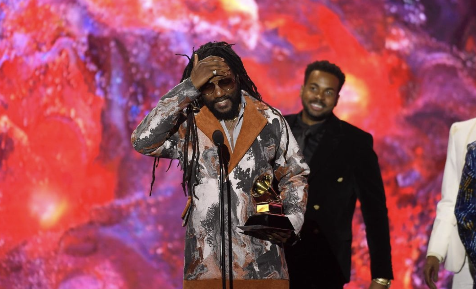 Jamaican artists Kabaka Pyramid collecting his Best Reggae Album award at the Grammys 2023