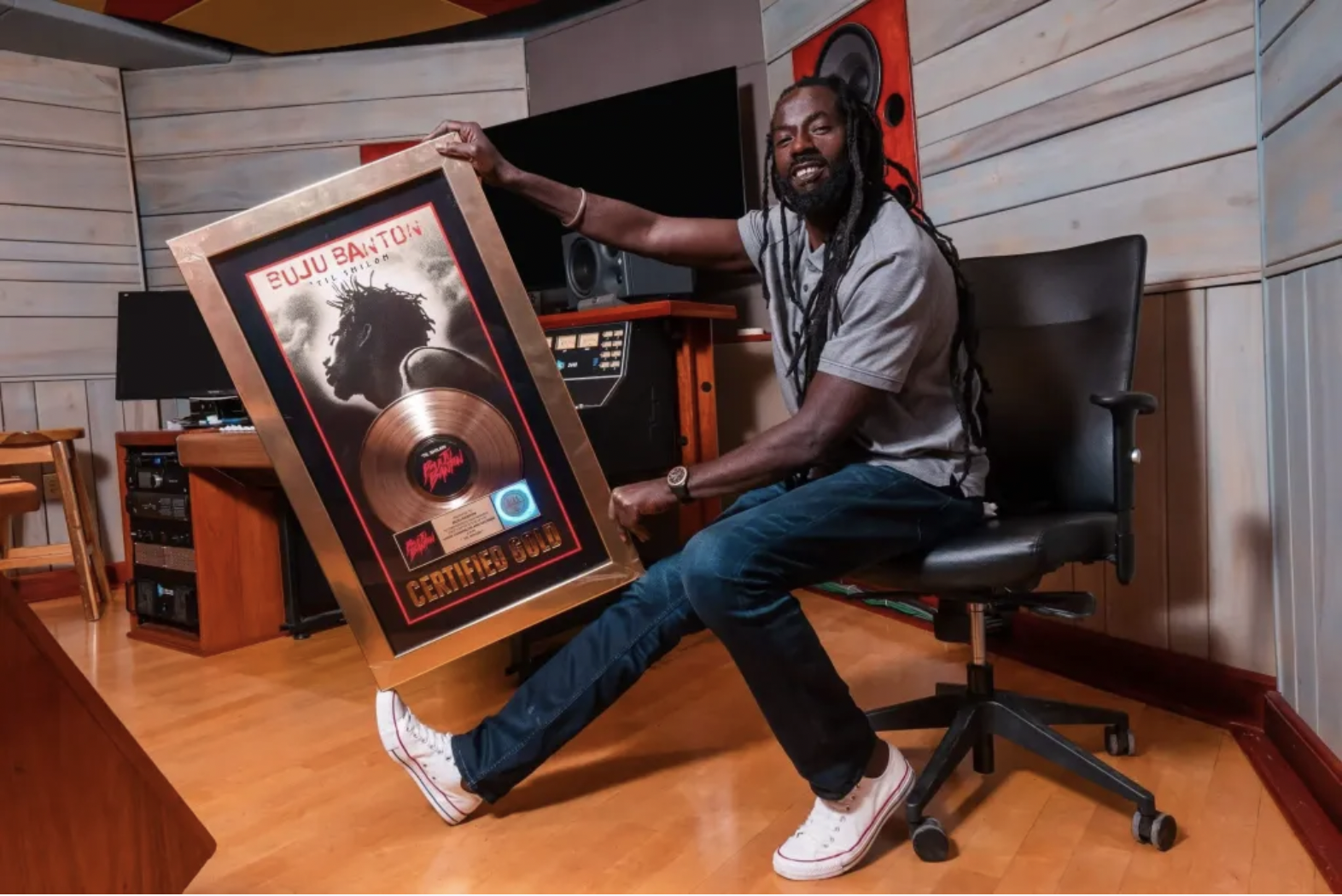 Buju Banton holds RIAA Gold plaque for Til Siloh album in 2019