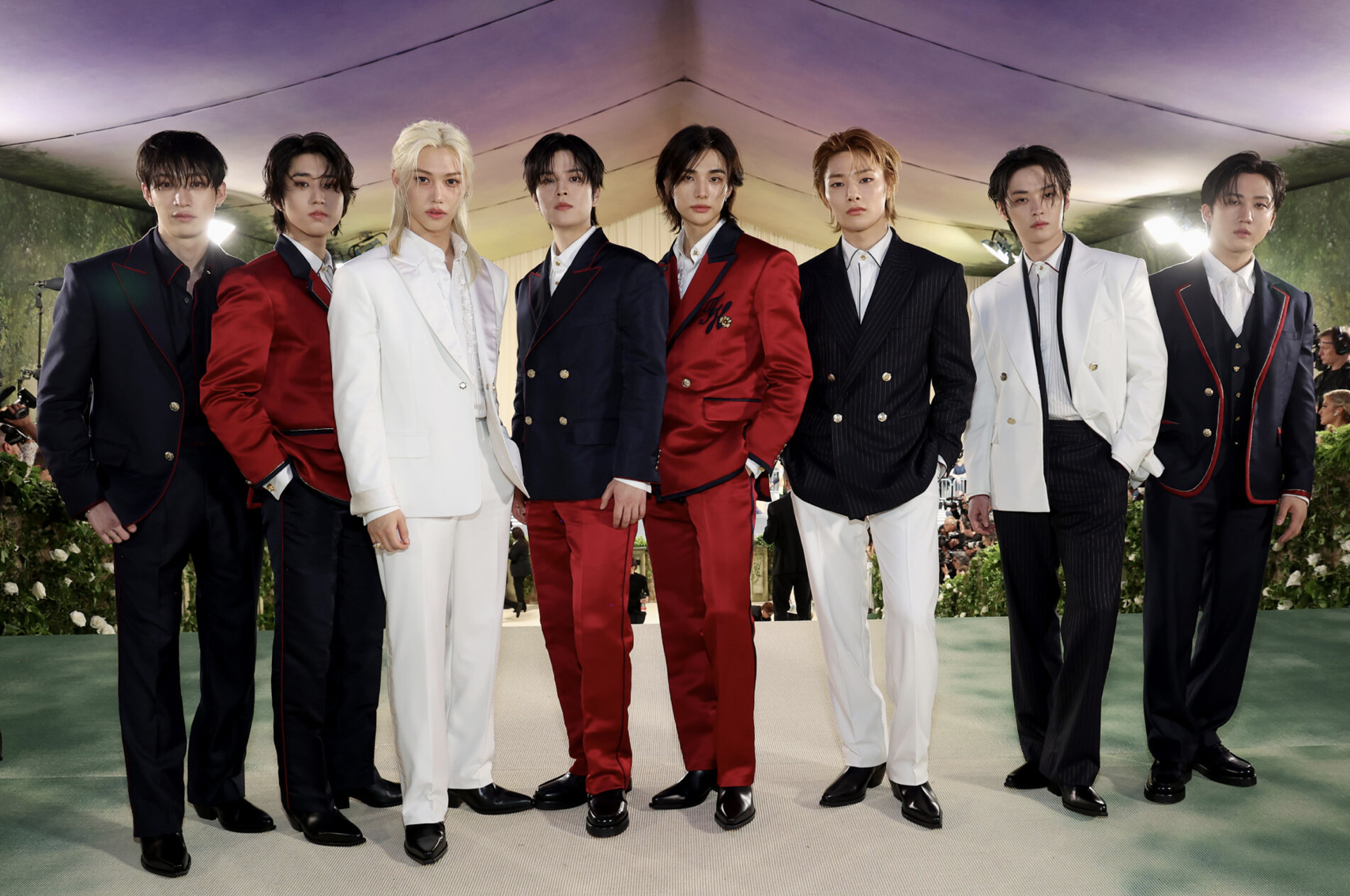 Bang Chan, Han, Felix, Seungmin, Hyunjin, I.N, Lee Know, and Changbin of Stray Kids attend The 2024 Met Gala (Image provided by Tommy Hilfiger: Photo by Kevin Mazur/MG24/Getty Images for The Met Museum/Vogue)