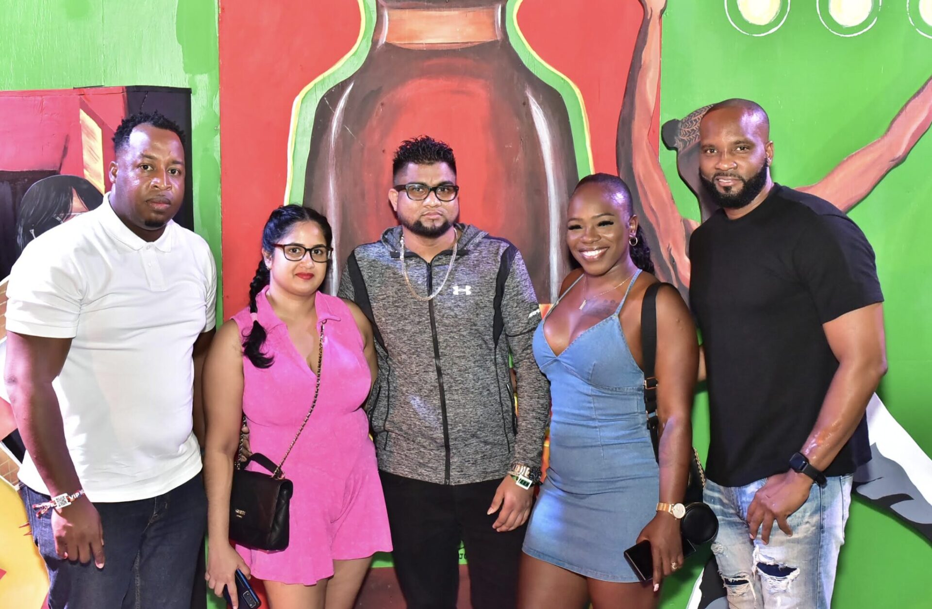 Chevanne Lawrence, Channel and Customer Marketing Manager at J. Wray & Nephew (left) and Kristoff Headley, Senior Brand Manager at AMCO (centre) gather for a photo with winners of Magnum's 'Win a Trip to the Ultimate Dancehall Experience' at Reggae Sumfest on Friday. From left are: Renay Bobb-Williams, Xavier Williams, Omela Dwarika and Sunil Dwarika