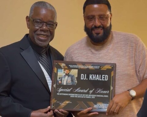 Dr. Ephraim Martin, presenting DJ Khaled with a SpecialAward of Honor at the 43rd Annual IRAWMA Awards on Sunday